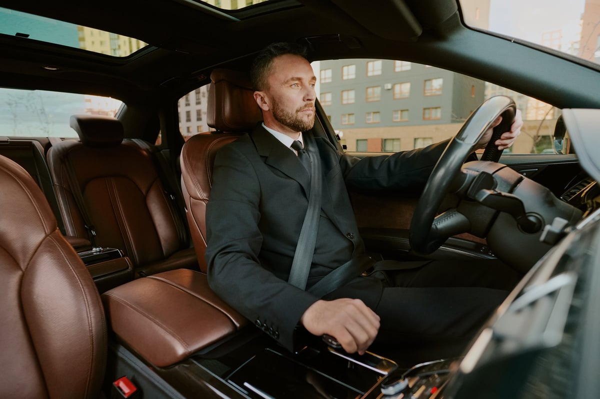 Professional medical practitioner driving a luxury vehicle — representing the premium experience of Islamic car finance tailored for doctors and healthcare professionals in Australia